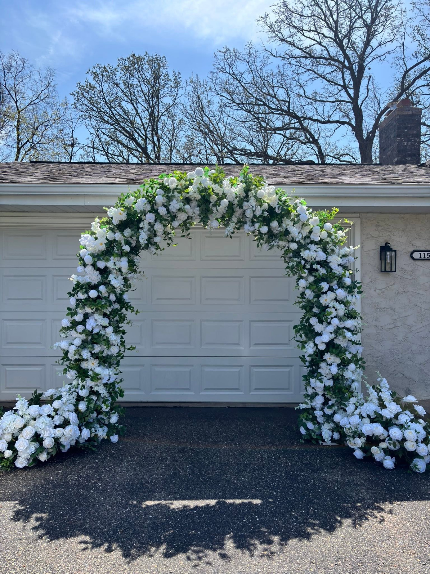 White floral ceremony arch styled by Severance Event Rentals